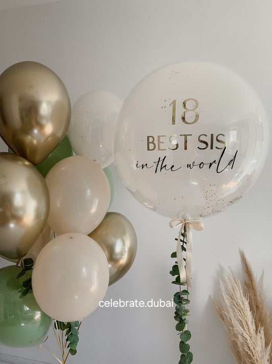Customized Balloon Bouquet: Personalized Bubble Balloon With Text And Fresh Eucalyptus And Mix Of Beige, Golden And Green Balloons